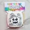 White vanilla biscuit with black pumpkin or witch outline White vanilla biscuit with black pumpkin or witch outline