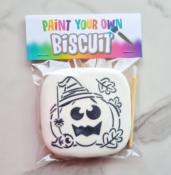 White vanilla biscuit with black pumpkin or witch outline White vanilla biscuit with black pumpkin or witch outline