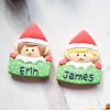 Two festive biscuit elves in red and green (1) Two festive biscuit elves in red and green